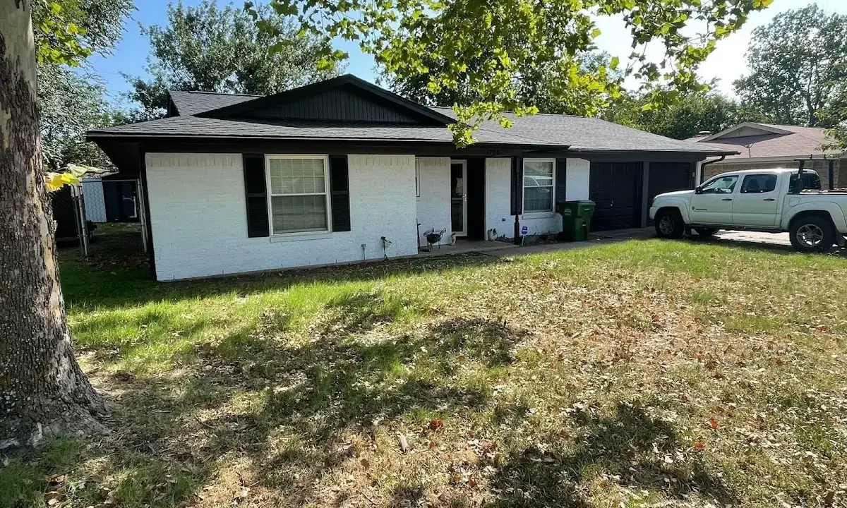 Professional roofing crew working on a residential roof in Stone Mountain